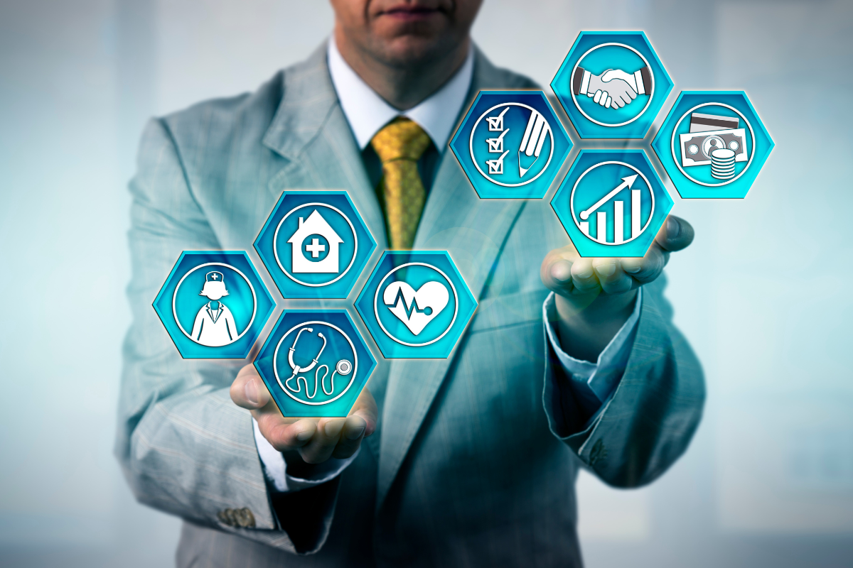 An image of a man in a business suit juggling icons representing various factors in healthcare management.